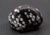 tumbled snowflake obsidian with snowflakes that are silicon dioxide polymorph cristobalite