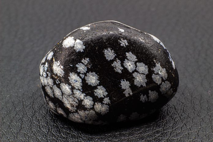 tumbled snowflake obsidian with snowflakes that are silicon dioxide polymorph cristobalite