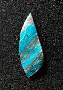 chrysocolla cabochon in curved rectangular shape with points at both ends