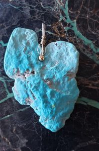 sleeping beauy turquoise pendant with inclusions