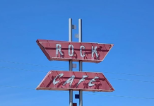 road sign for the rock cafe oklahoma