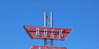 road sign for the rock cafe oklahoma