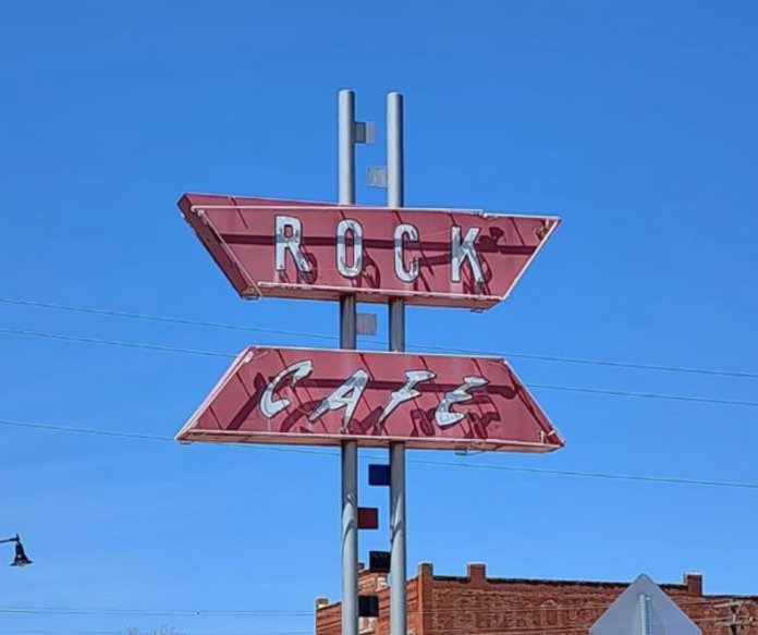 road sign for the rock cafe oklahoma